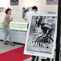 A poster advertising the 1964 Tokyo Paralympics is displayed at an exhibit at the Japanese Red Cross Society in August. | RYUSEI TAKAHASHI