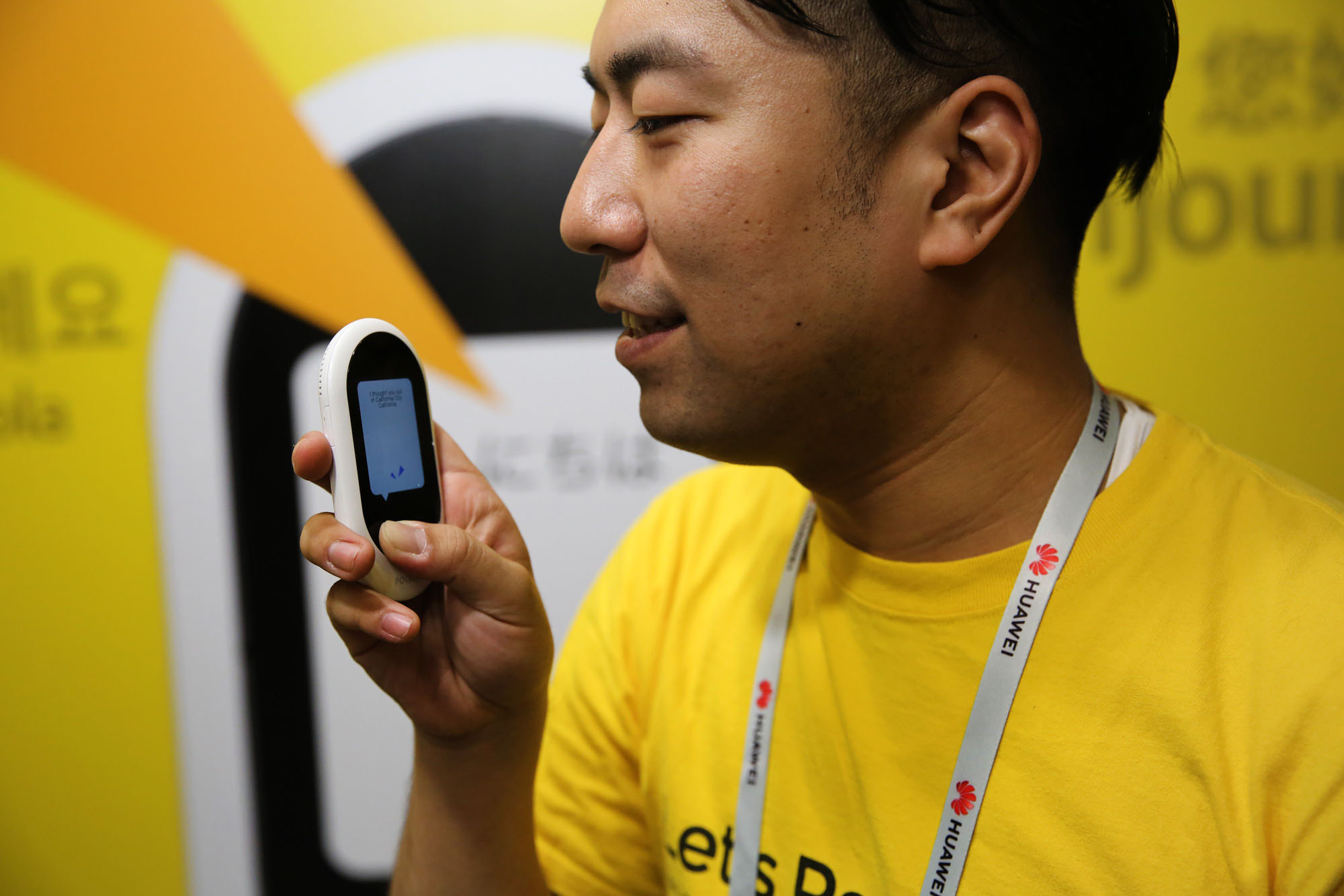 A Pocketalk mobile language translation unit is demonstrated at the Sourcenext Corp. stand during a trade fair in Barcelona, Spain, in February. | BLOOMBERG