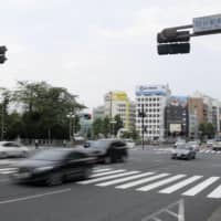 A crosswalk in front of JR Yotsuya Station in Tokyo is seen Sunday after an incident earlier the same day in which a police car hit and seriously injured a 4-year-old boy. | KYODO