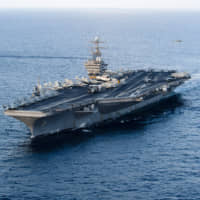 The Nimitz-class aircraft carrier USS Abraham Lincoln is shown in the Arabian Sea in January 2012. | UPI / VIA KYODO