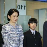 Crown Princess Kiko and her son Prince Hisahito arrive at Haneda Airport in Tokyo on Sunday after a weeklong private family vacation in Bhutan. | KYODO
