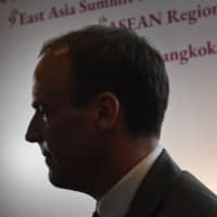 Britain\'s Foreign Secretary Dominic Raab walks through the venue of the 52nd Association of Southeast Asian Nations (ASEAN) Foreign Ministers\' Meeting in Bangkok on Thursday. | AFP-JIJI
