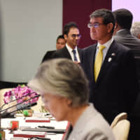 Foreign Minister Taro Kono (right) and South Korean counterpart Kang Kyung-wha (front)attend a meeting of foreign ministers on the sidelines of the 52nd Association of Southeast Asian Nations meeting in Bangkok on Aug. 2. | AFP-JIJI