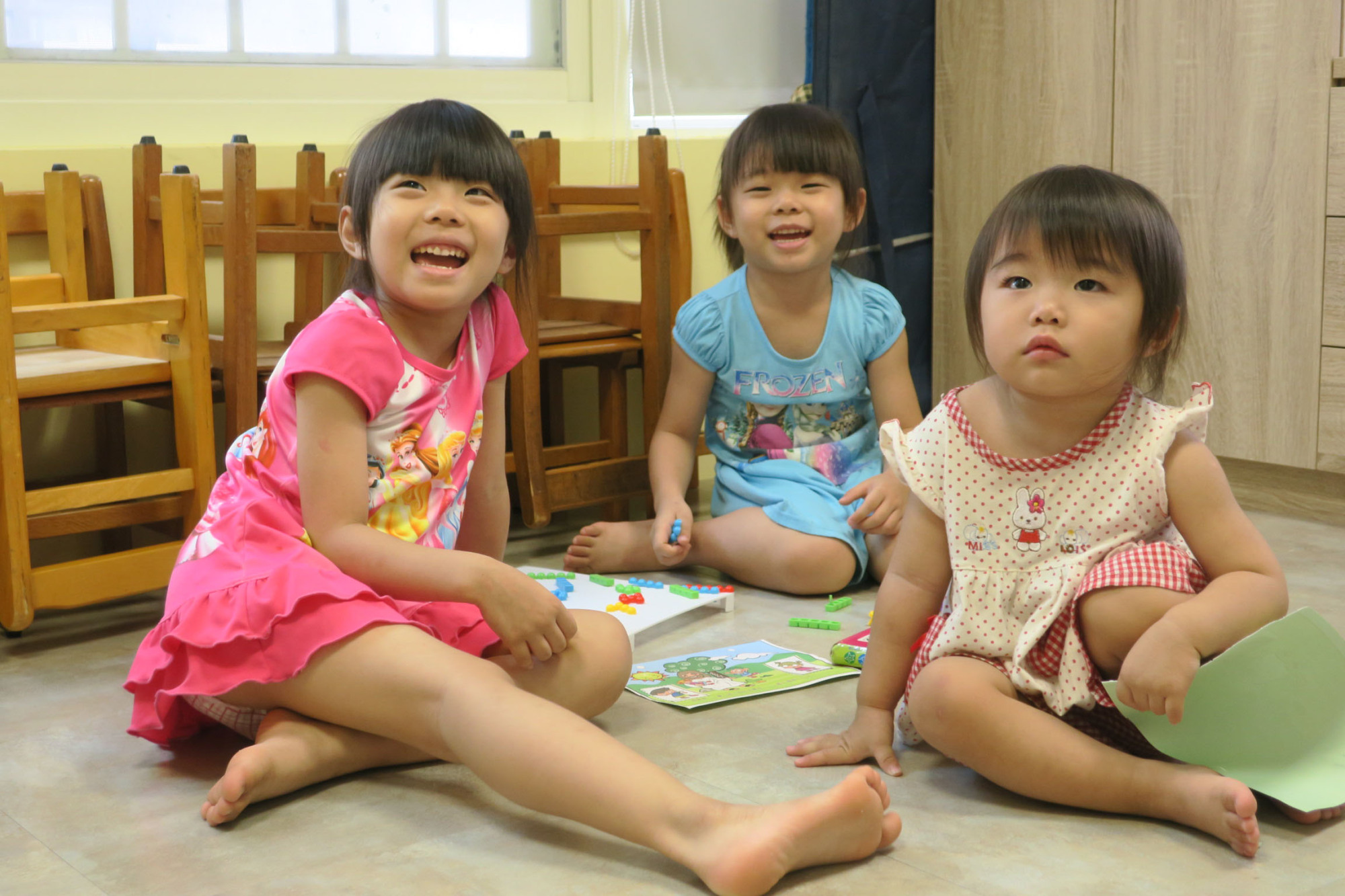 Children play at a preschool in Taipei in June. | KYODO