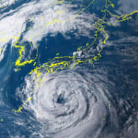 A satellite photo provided by the National Institute of Information and Communications Technology shows Typhoon Krosa approaching Japan on Tuesday. | KYODO