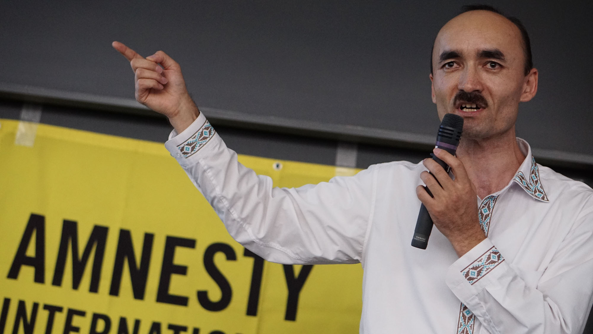 Afumetto Retepu, who lost contact with 12 members of his family, calls for support in finding the truth about the  fate of the Uyghurs in China's Xinjiang province, during a symposium in Tokyo on July 6. | MAGDALENA OSUMI
