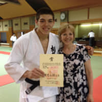 Raising an athlete: Sanshiro Murao, a Judo World Championship participant and his mother, Deborah Grow, pose for a picture together. Deborah says she admires her son\'s determination in pursuing his dream of being an Olympian | COURTESY OF             DEBORAH GROW