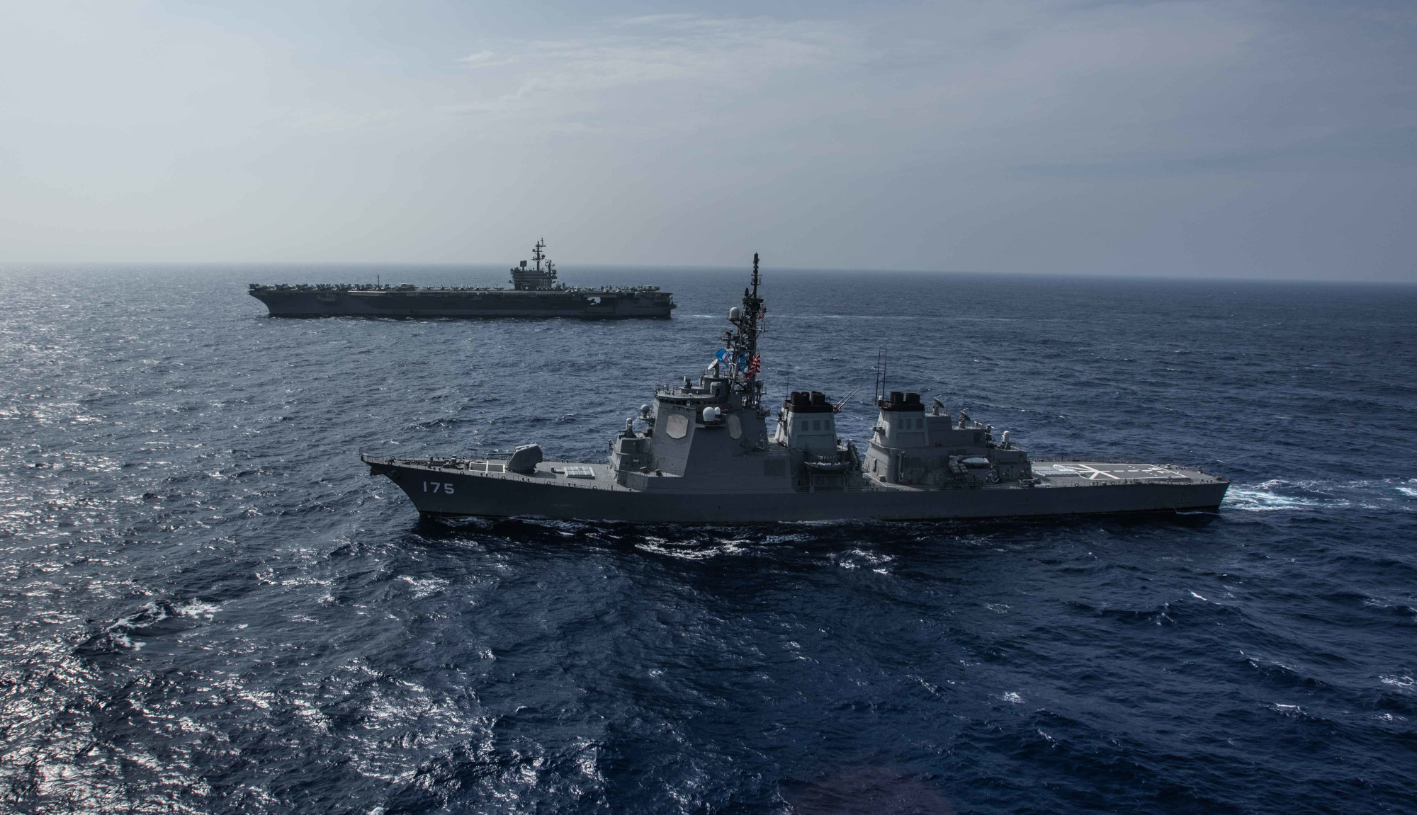 The Maritime Self-Defense Force guided-missile destroyer Myoko sails with the USS Ronald Reagan aircraft carrier in the Philippines Sea on Aug. 15. The Japan-U.S. alliance plays a key role in Japan's 'Free and Open Indo-Pacific Strategy.' | USS RONALD REAGAN (CVN 76)