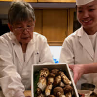 Mushroom master: Chef Kenichiro Nishi (left), who passed away July 26, at work in his restaurant, Kyoaji. | ROBBIE SWINNERTON