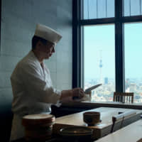 Meal prep: Chef Kazuo Ogura gets ready to serve up some sushi. | ROBBIE SWINNERTON