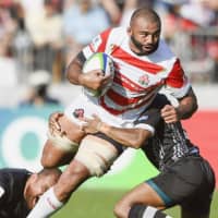 Brave Blossoms captain Michael Leitch, seen playing in a Pacific Nations Cup match against Fiji on July 27, is one of 16 foreign-born players on Japan\'s Rugby World Cup squad. | KYODO