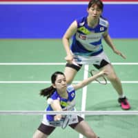 Wakana Nagahara (top) and Mayu Matsumoto compete in the women\'s doubles quarterfinals at the Badminton World Championships on Friday in Basel, Switzerland. | KYODO