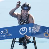 Wakako Tsuchida finishes first in the women\'s wheelchair class of Saturday\'s event at the International Triathlon Union\'s Paratriathlon World Cup in Tokyo on Saturday. | KYODO