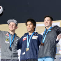 Gold medalist Tomoa Narasaki (center) poses with runner-up Jakob Schubert, of Austria (left), and bronze medalist Rishat Khaibullin, of Kazakhstan, after the men\'s combined at the world championships on Wednesday. | KAZ NAGATSUKA