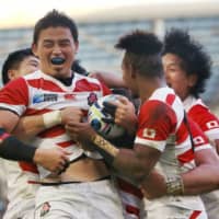 Ayumu Goromaru celebrates with his Brave Blossoms teammates after scoring a try during their epic upset of South Africa at the 2015 Rugby World Cup in Brighton, England. A new film highlights what went on behind the scenes in the lead-up to Japan\'s trumph over over two-time world champion South Africa. | KYODO