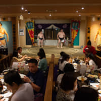 A sumo-themed restaurant run by O-Sumo San Promotions in Ryogoku, Tokyo, has a regulation ring surrounded by tables. | JOHN GUNNING