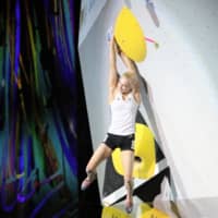 Slovenia\'s Janja Garnbret completes a bouldering route during the women\'s combined at the IFSC World Championships at Esforta Arena Hachioji on Tuesday. | KAZ NAGATSUKA