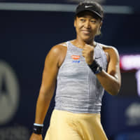 Naomi Osaka reacts after defeating Iga Swiatek during the Rogers Cup on Thursday in Toronto. Osaka reclaimed the No. 1 spot in the WTA rankings despite exiting the tournament in the quarterfinals. | USA TODAY / VIA REUTERS