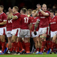 Wales celebrates a 13-6 victory over England in World Cup warm-up match in Cardiff last Saturday. Wales replaced New Zealand as the world No. 1. | REUTERS