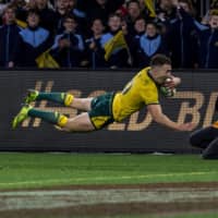 Australia\'s Nic White scores a try during a Rugby Championship test match against New Zealand on Saturday in Perth, Australia. | AFP-JIJI