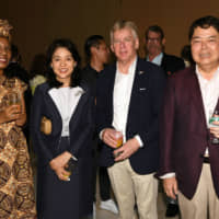 At his farewell reception, Belgian Ambassador Gunther Sleeuwagen (second from right) and his wife, Rahel Zewdie Sleeuwagen (left), pose with Kaori Kono (second from left), wife of Foreign Minister Taro Kono, and Yoshimasa Hayashi, chairman of the Japan-Belgium Parliamentary Friendship League, at the Belgian Embassy on July 28. | YOSHIAKI MIURA