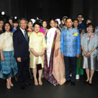 Thai Culture Minister Itthiphol Kunplome (third from right) poses for a photo alongside designer Prapakas Angsusingha (far left), Thai Ambassador Bansarn Bunnag (third from left) and his wife, Yupadee (fourth from left), as well as other participants and models from the show. | YOSHIAKI MIURA