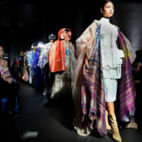Models walk down the runway during a contemporary Thai fashion show. | YOSHIAKI MIURA