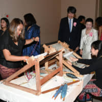 An event titled \"Thai Textile: A Touch of Thai\" was held at Tokyo National Museum in Ueno Park on Aug. 19. Kiminori Iwama, chief of protocol at the Foreign Ministry, and his wife, Tomomi watch a demonstration of Thai textiles. | YOSHIAKI MIURA