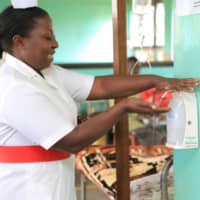 A Ugandan nurse uses Alcohol Hand Sanitizer to wash her hands. Since 2012, Saraya Co.  has promoted improved hygiene in hospitals as part of its larger and ongoing efforts across several countries in Africa. | SARAYA CO.