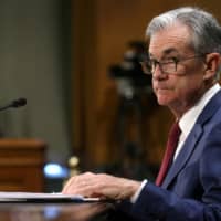Federal Reserve Board Chairman Jerome Powell testifies before a Senate Banking, Housing and Urban Affairs Committee hearing on the \"Semiannual Monetary Policy Report to Congress\" on Capitol Hill in Washington in July. | REUTERS