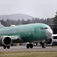 A Boeing 737 Max 8, being built for American Airlines, makes a turn on the runway as it\'s readied for takeoff on a test flight in Renton, Washington, in May. American Airlines says it is delaying the expected return date for its Boeing 737 Max jets. The airline said Sunday that while it \"remains confident\" that coming software updates and training will mean recertification of the aircraft this year, it is extending cancellations for Max flights through Dec. 3. | AP