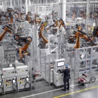 Robots weld car body components for vehicles at a BMW assembly plant in Greer, South Carolina. | BLOOMBERG