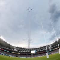 Blue Impulse aerobatic corps flies over Tokyo Stadium ahead of the opening ceremony of the 2019 Rugby World Cup. | REUTERS