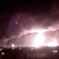 Saudi Aramco oil-processing facilities burn after a drone strike claimed by Yemen\'s Iran-aligned Houthi group in Buqayq on Saturday. | VIA REUTERS