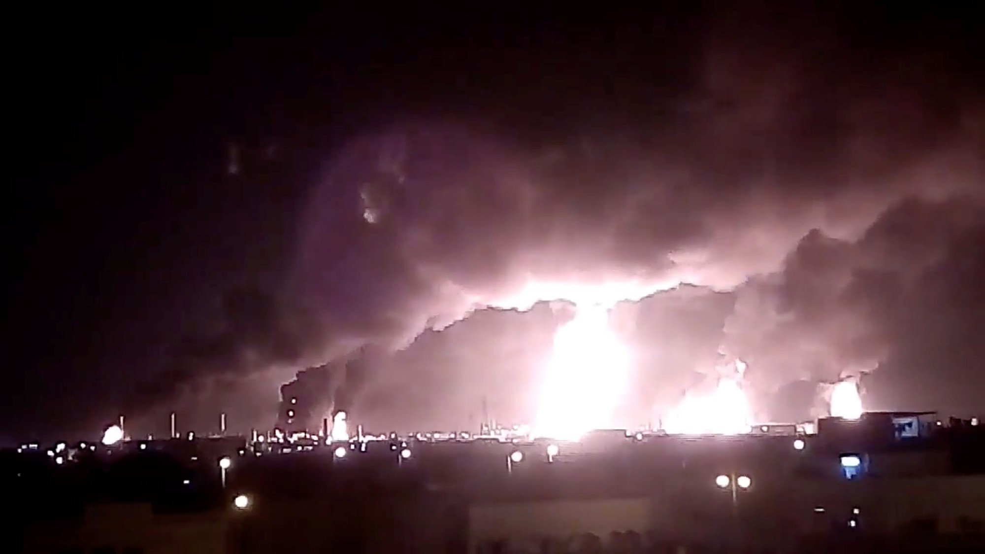 Saudi Aramco oil-processing facilities burn after a drone strike claimed by Yemen's Iran-aligned Houthi group in Buqayq on Saturday. | VIA REUTERS