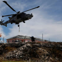 A helicopter takes off outside Marsh Harbour Healthcare Center after hurricane Dorian hit the Abaco Islands in Marsh Harbour, Bahamas, Thursday. | REUTERS