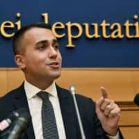 Head of the M5S Five start political movement, outgoing Italian Labor and Industry Minister and Deputy Prime Minister Luigi Di Maio, speaks during a news conference in Rome\'s Deputy chamber on Tuesday ahead of the M5S decision to put its new government deal to a vote among its members through its online platform \"Rousseau.\" | AFP-JIJI