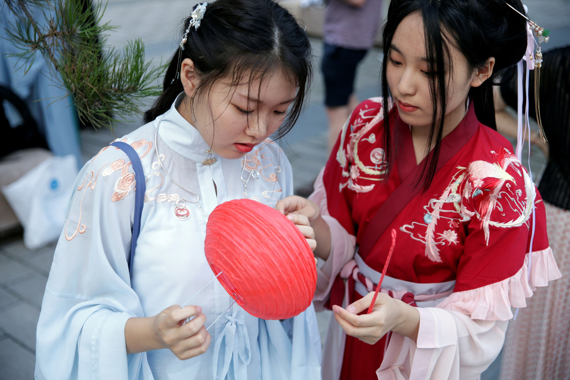 Young Chinese women give tradition a nod by wearing Hanfu costumes