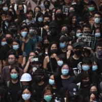 Students attend a rally at the University of Hong Kong on Monday to highlight the five demands protesters are asking from the government. | AFP-JIJI