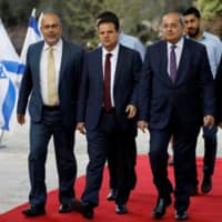 Members of the Joint List party arrive at the residence of Israeli President Reuven Rivlin in Jerusalem on Sunday to begin talks about who should form a new government. | REUTERS