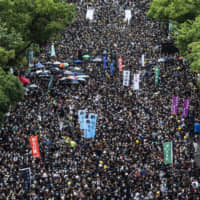Students gather on the University Mall at the Chinese University of Hong Kong during a class boycott rally on Monday. | BLOOMBERG
