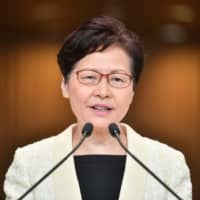 Hong Kong Chief Executive Carrie Lam speaks to the media during a weekly news conference in Hong Kong on Tuesday. | AFP-JIJI