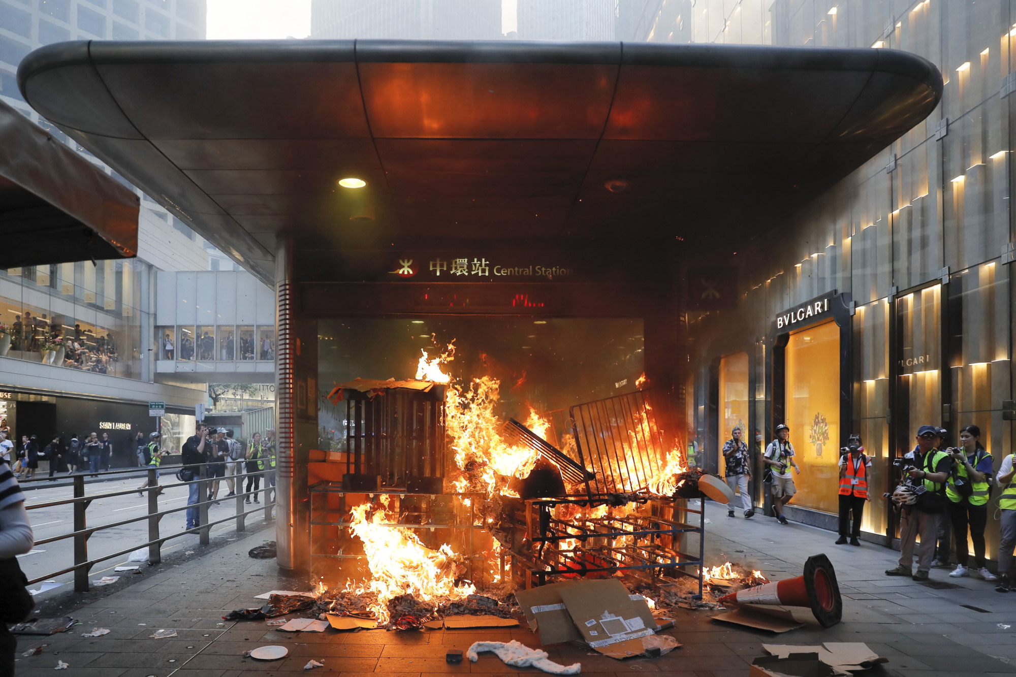 A fire set by protesters burns at an entrance to the Central MTR subway station in Hong Kong on Sept. 8. | AP