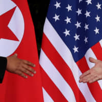U.S. President Donald Trump and North Korea\'s leader Kim Jong Un meet at the start of their summit at the Capella Hotel on the resort island of Sentosa, Singapore, in 2018. | REUTERS