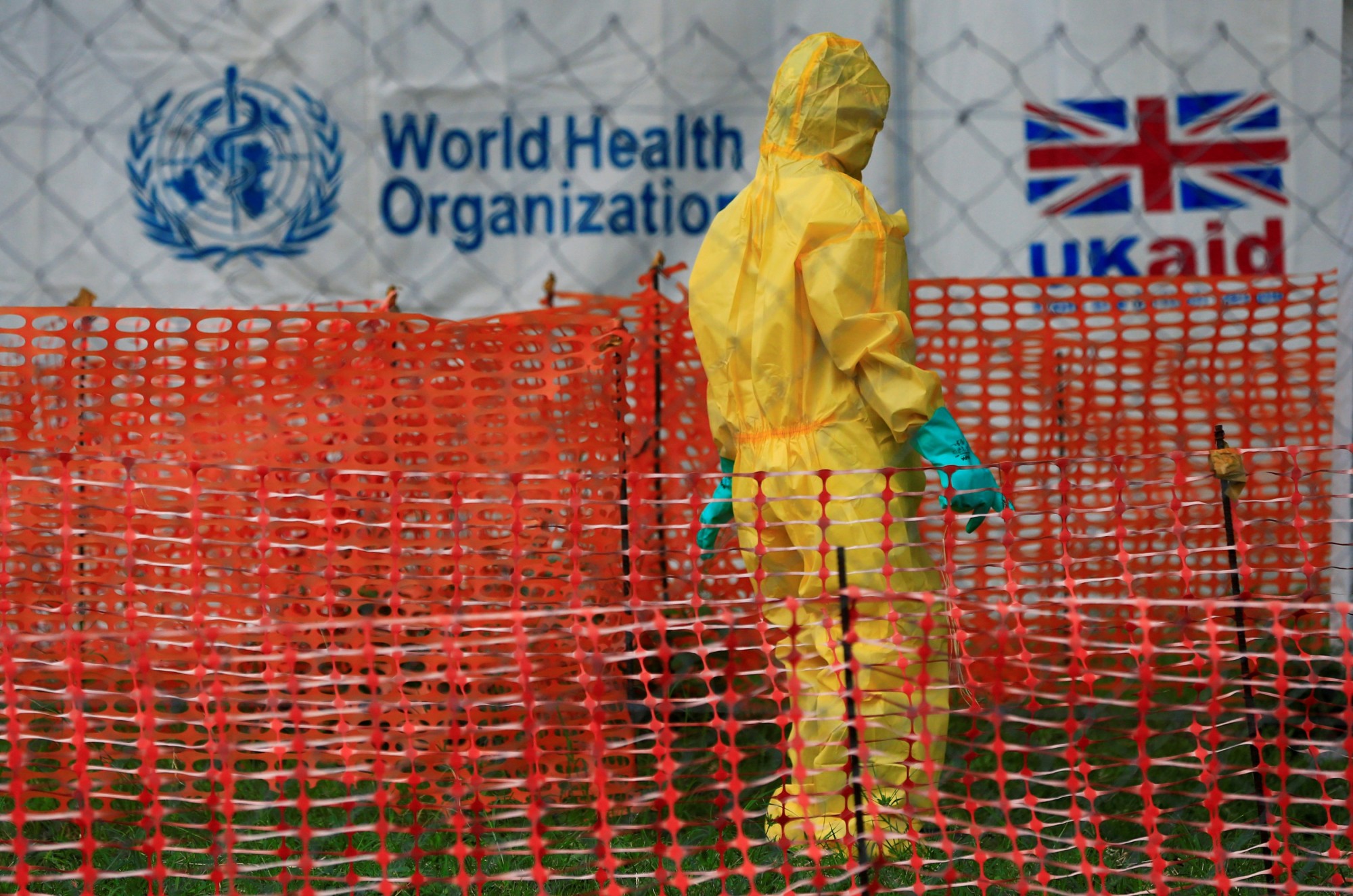 A person in protective gear works in an Ebola care facility on June 14 at the Bwera hospital in Bwera, Uganda, near the border with Congo. | REUTERS
