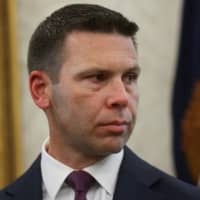 Acting Homeland Security Secretary Kevin McAleenan looks on as U.S. President Donald Trump speaks in the Oval Office of the White House in Washington July 26. | REUTERS