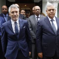 Moroccan Interior Minister Abdelouafi Laftit (right) and his Spanish counterpart, Fernando Grande-Marlaska, pose for a picture following a meeting in Rabat on Wednesday. | AFP-JIJI
