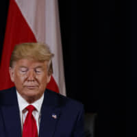 President Donald Trump listens during a meeting with Polish President Andrzej Duda at the InterContinental Barclay hotel during the United Nations General Assembly, Monday in New York. | AP