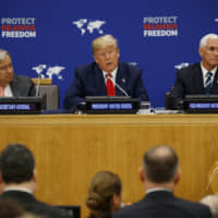 United Nations Secretary General Antonio Guterres (left) and Vice President Mike Pence listen as President Donald Trump speaks at an event on religious freedom during the United Nations General Assembly Monday in New York. | AP