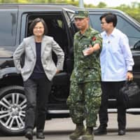Taiwanese President Tsai Ing-wen arrives at a military base in Hsinchu, northern Taiwan, on Tuesday. | AFP-JIJI